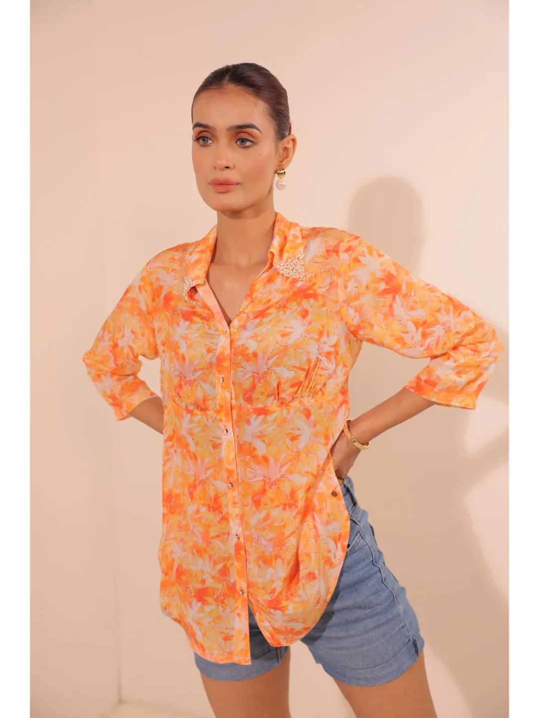 natural crepe abstract printed,  mandarin hand embellished collar stylised gathered busted top with three fourth sleeve. - Orange