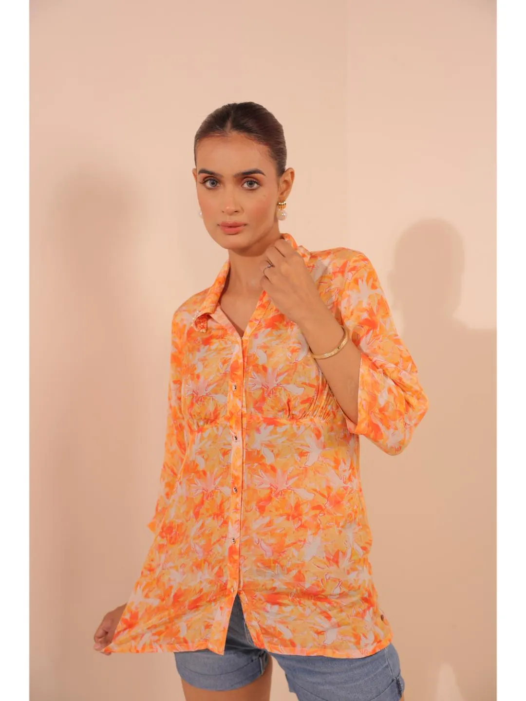 natural crepe abstract printed,  mandarin hand embellished collar stylised gathered busted top with three fourth sleeve. - Orange