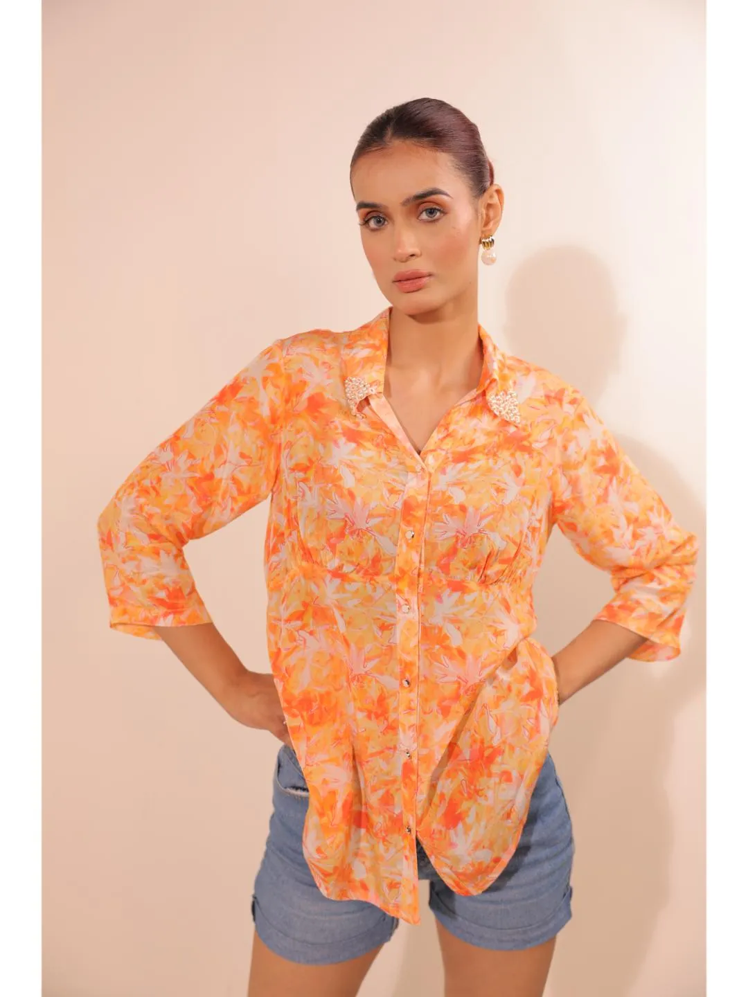 natural crepe abstract printed,  mandarin hand embellished collar stylised gathered busted top with three fourth sleeve. - Orange